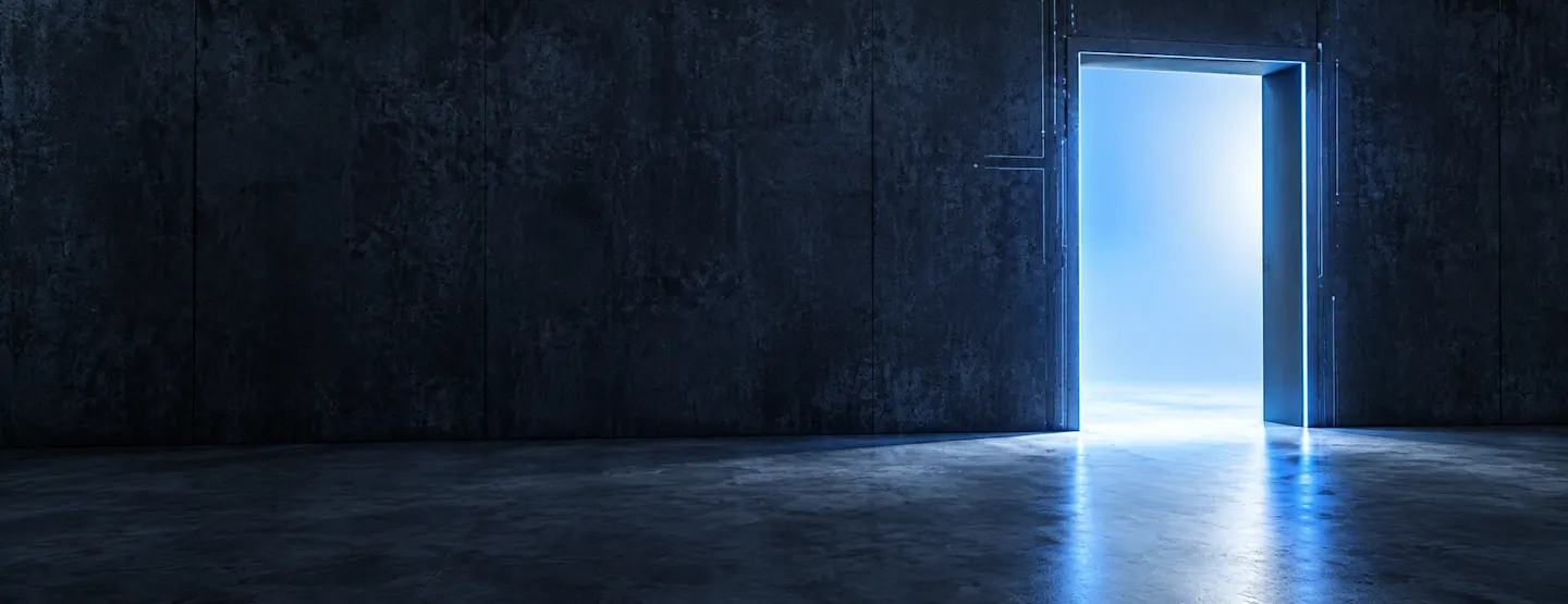 Glowing doorway through a dark wall.png