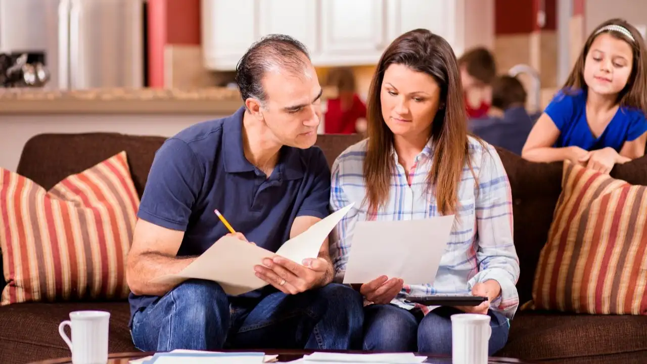 Couple work together to pay their monthly bills. 