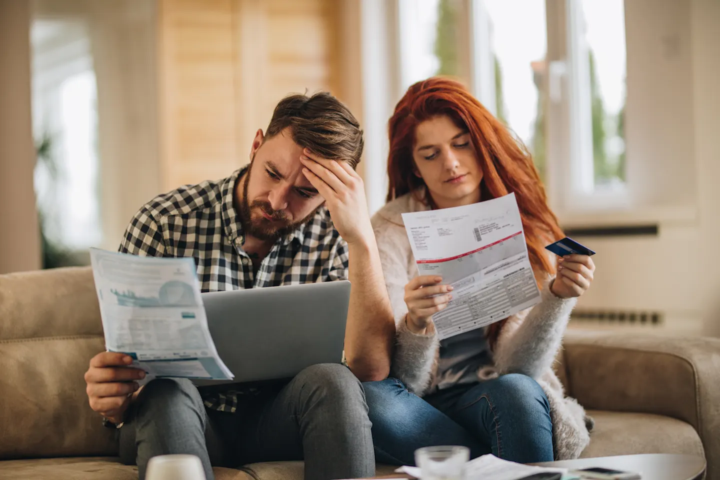 Couple looks at bills.