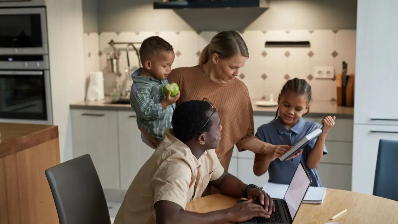 Family with two kids in home interior 